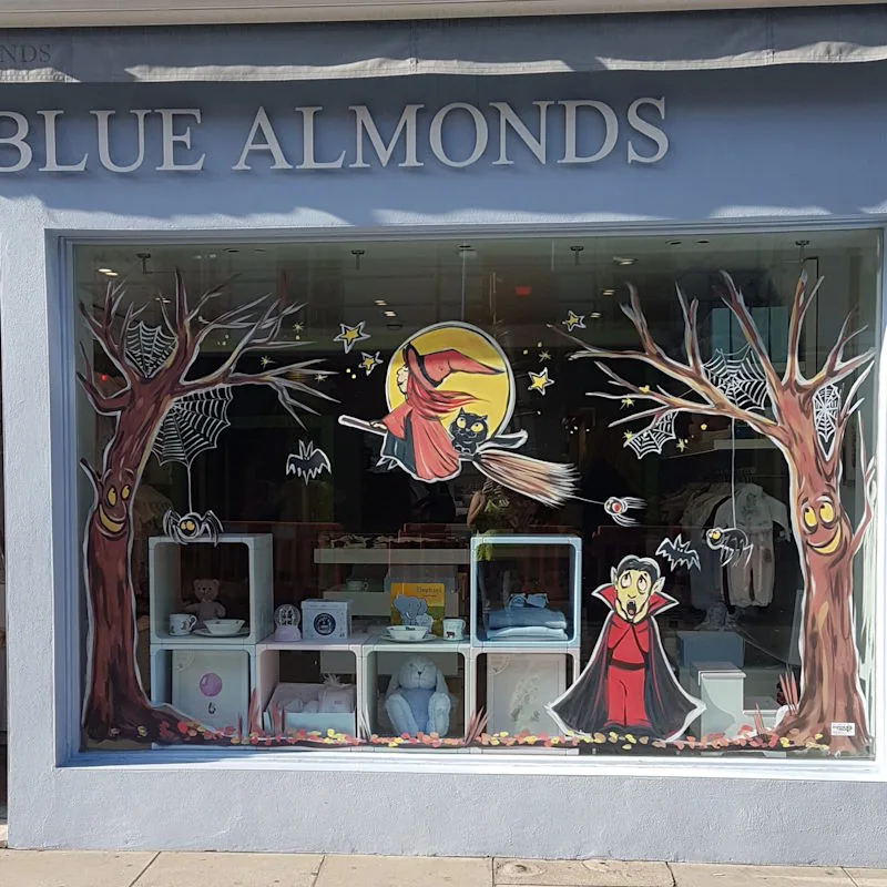 Enlarge image: Hand-painted Halloween window scene, witch and cat on broom, Dracula, spiders and bats.